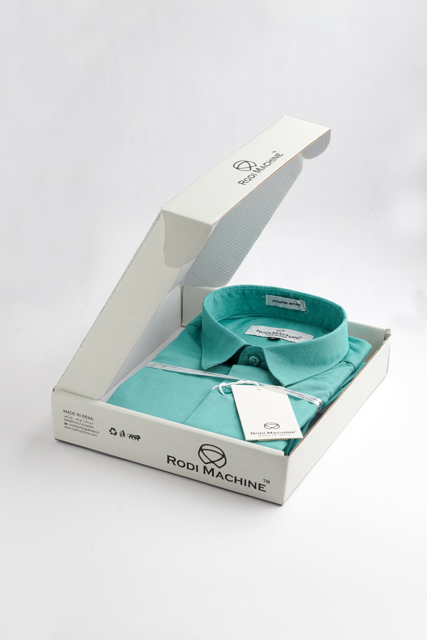 Cian colour Rodi Machine shirt in a white box with 'Rodi Machine' branding on a light gray background