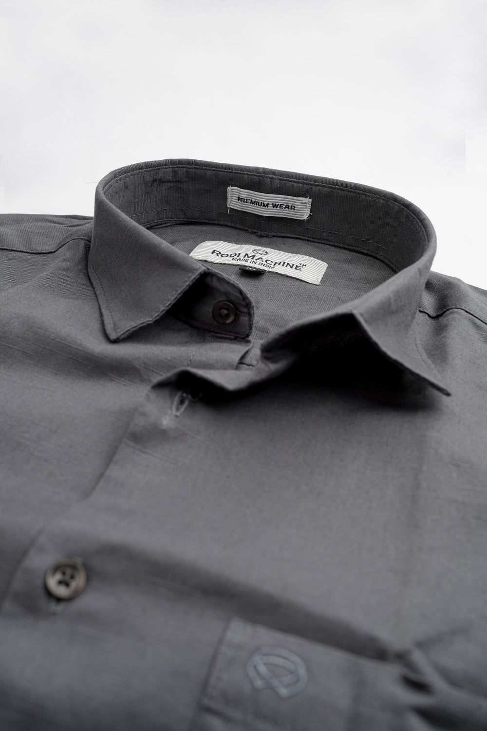 Ash colour Rodi Machine shirt with collar and brand labels on a light gray background