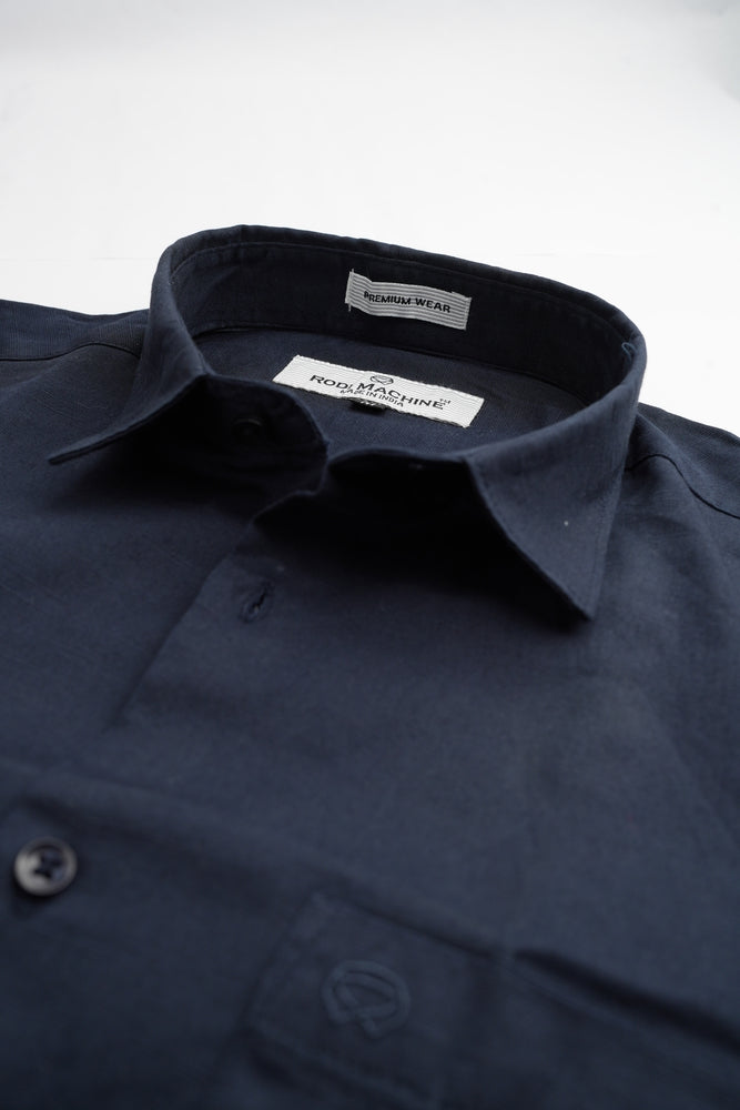 Close-up of a Navy Blue colour Rodi Machine shirt with a collar and brand label on a white background