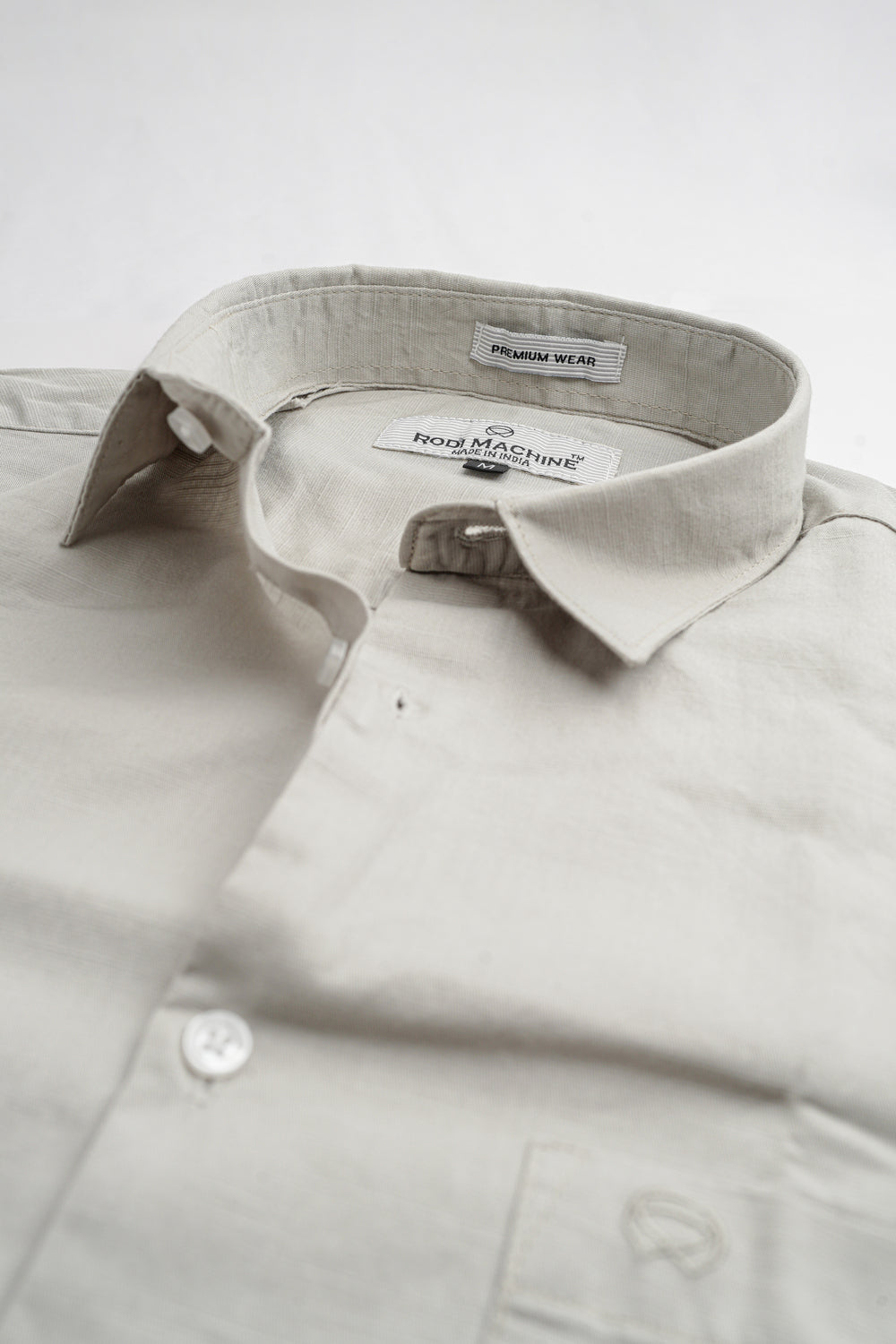Gray colour Rodi Machine shirt with collar and label on a white background