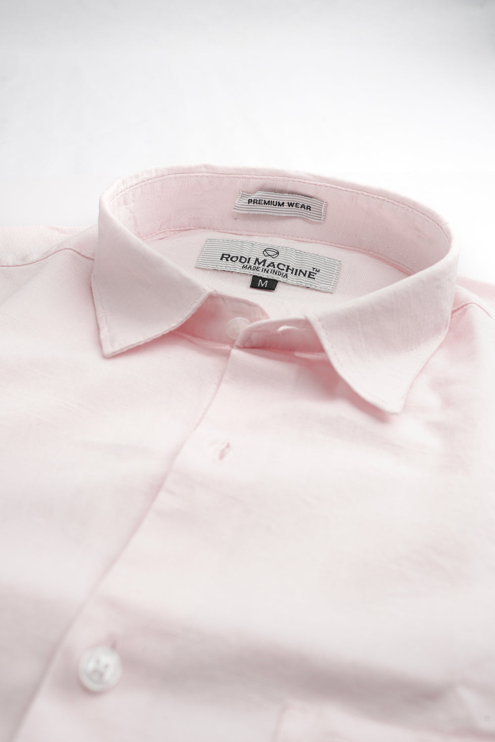 Pink colour Rodi Machine shirt with a visible brand label on a white background