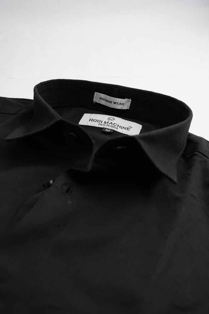 Close-up of a Black colour Rodi Machine shirt with a brand label on a white background