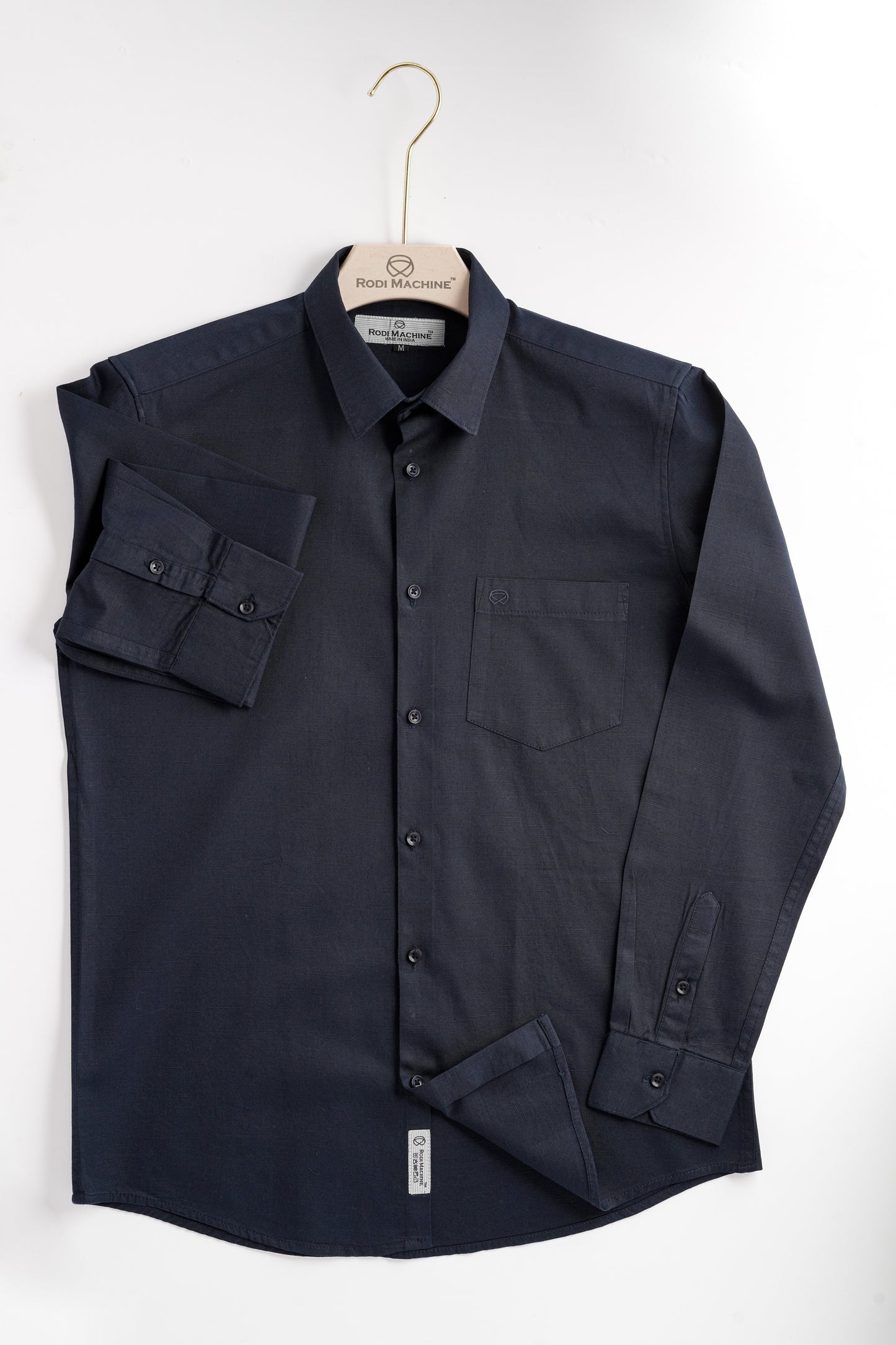 Navy Blue colour Rodi Machine shirt on a hanger against a white background