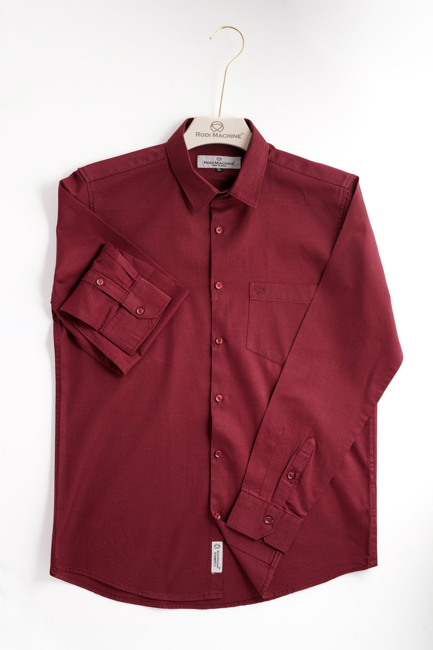 Maroon colour Rodi Machine shirt on a hanger against a white background