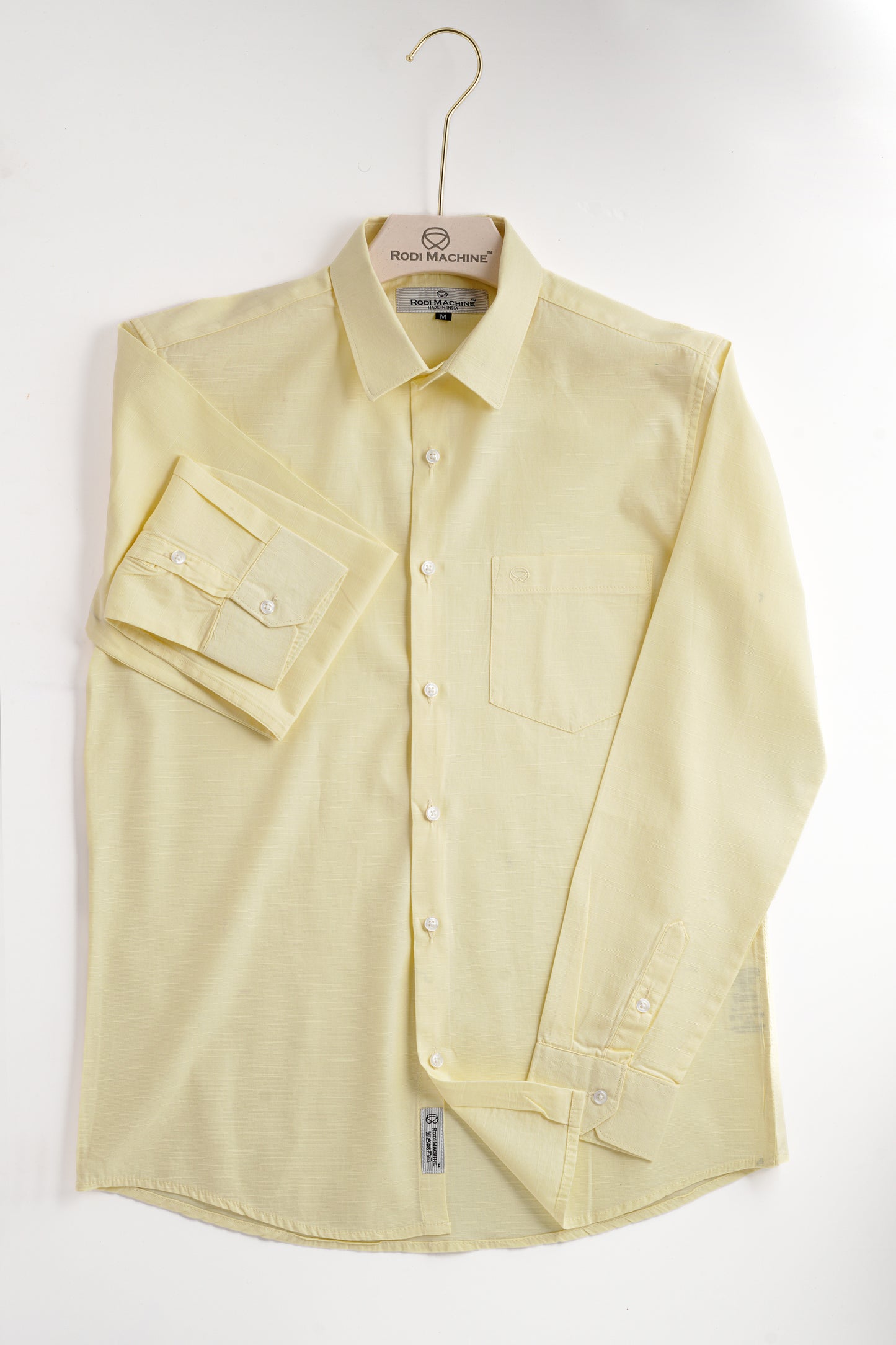 Yellow colour Rodi Machine shirt on a hanger against a white background